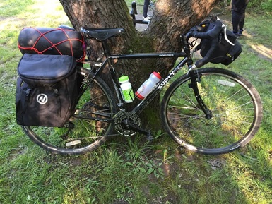 Bicycle showing a handle bar bag for a bike camping trip near Chicago for the Out Our Front Door Organization